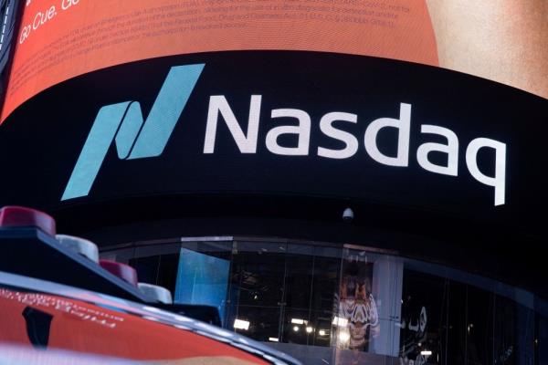 Nasdaq slips from near all-time high, Dow up modestly ahead of inflation data
